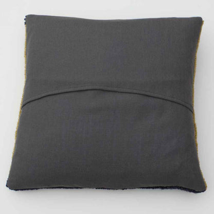 Hand tufted isosceles cushion